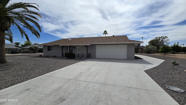 single story home featuring a garage and concrete driveway