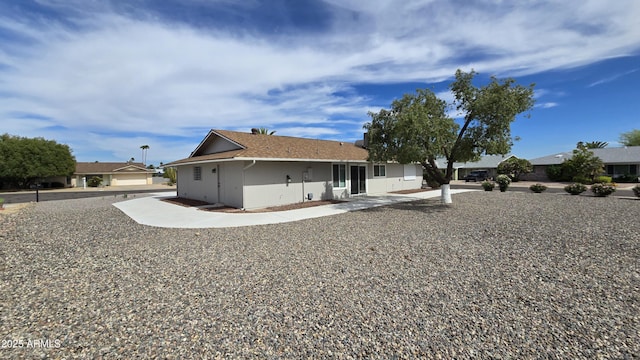 back of property with stucco siding