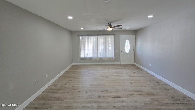 entryway featuring recessed lighting, ceiling fan, light wood-style flooring, and baseboards