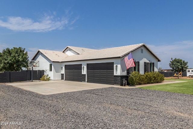 view of home's exterior featuring a garage and a yard