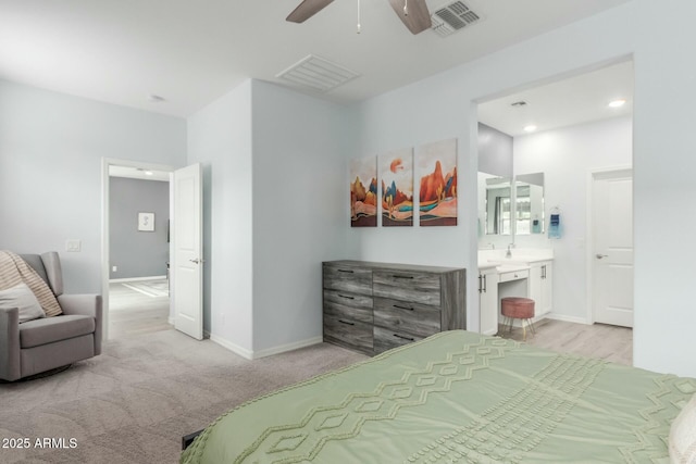 carpeted bedroom featuring connected bathroom and ceiling fan