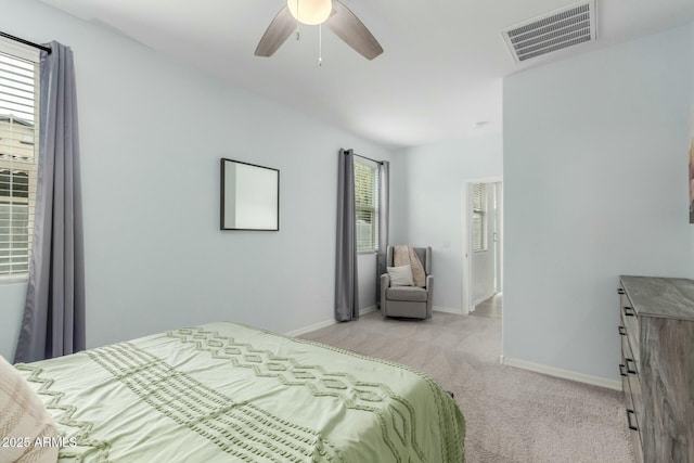 bedroom with light carpet and ceiling fan