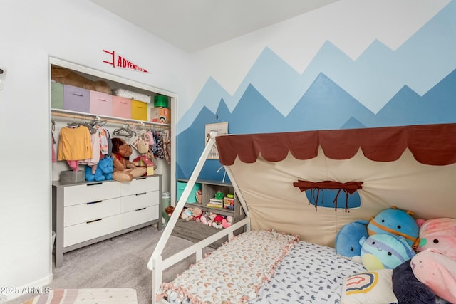 bedroom featuring light colored carpet and a closet