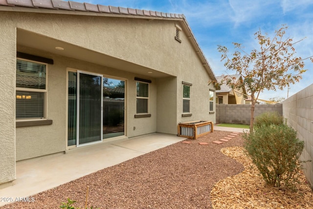 back of house with a patio