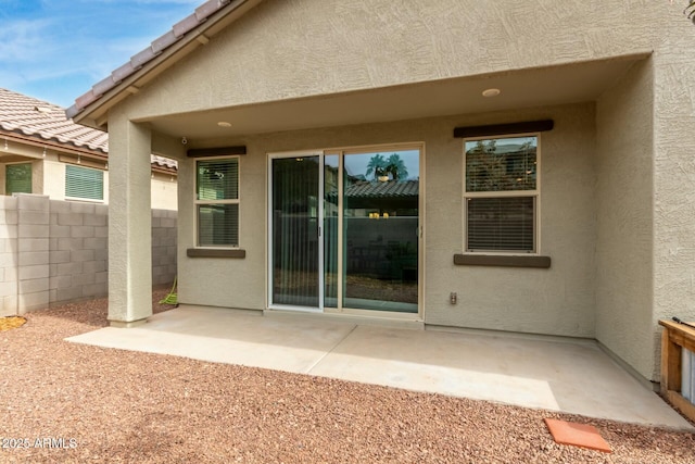 back of house with a patio