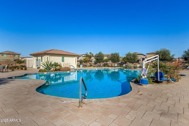 view of swimming pool featuring a patio area