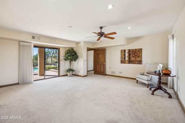 sitting room with recessed lighting, visible vents, light carpet, and baseboards