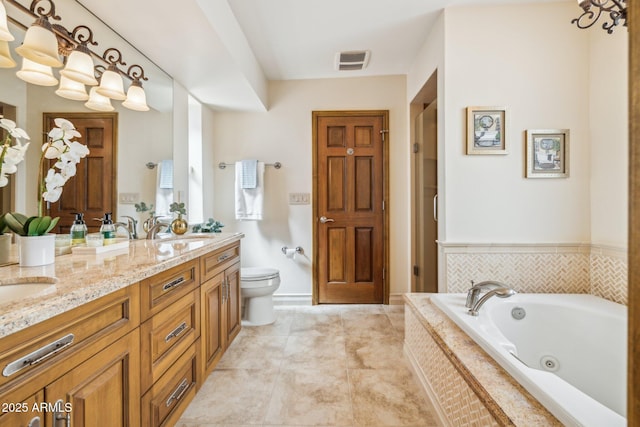 full bath with a sink, a jetted tub, toilet, and double vanity