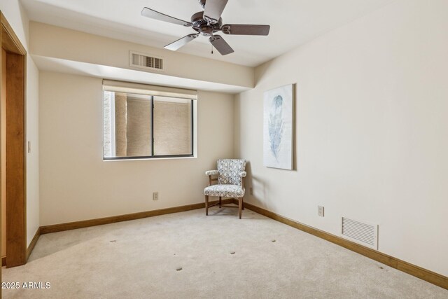 unfurnished room with baseboards, visible vents, and carpet flooring