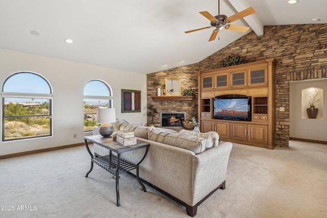 living room with light carpet, a fireplace, high vaulted ceiling, and beam ceiling