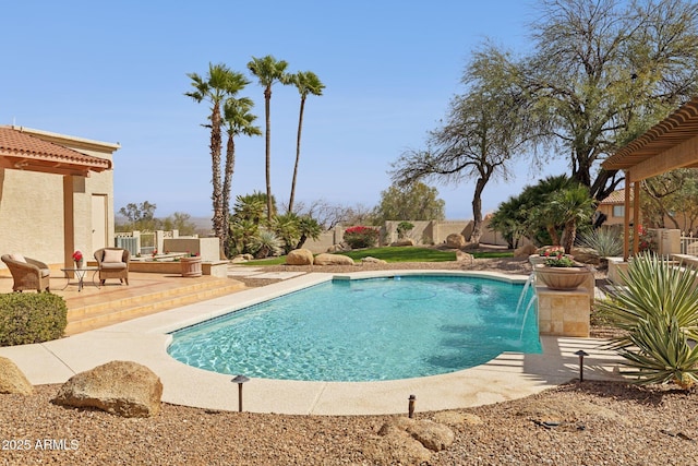 outdoor pool featuring a patio area and a fenced backyard