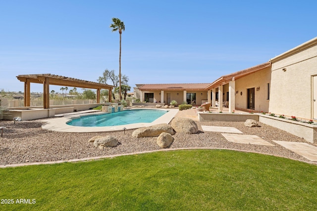 pool with a patio area, a pergola, and a yard