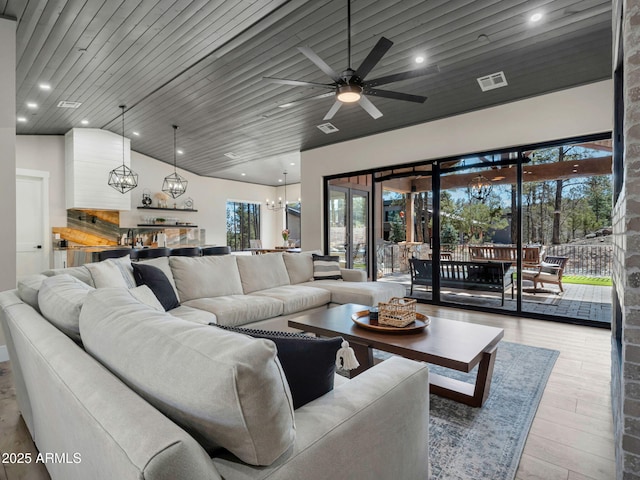 1137 Timbernook Xing, Williams, AZ 86046 - living room featuring a ceiling fan, a chandelier, lofted ceiling, wood finished floors, and recessed lighting