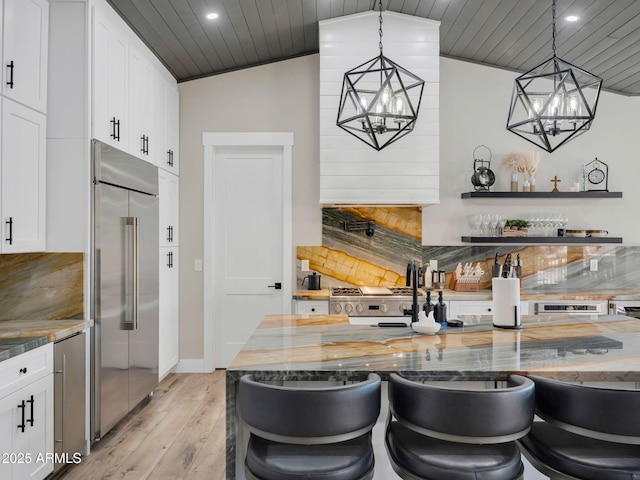 1137 Timbernook Xing, Williams, AZ 86046 - kitchen with built in refrigerator, light wood-style flooring, a chandelier, light stone countertops, and wooden ceiling