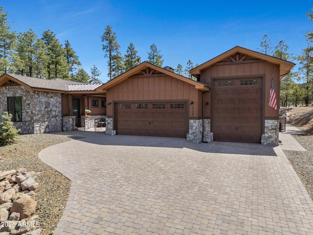 1137 Timbernook Xing, Williams, AZ 86046 - ranch-style house featuring stone siding, a garage, and driveway