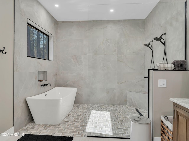 1137 Timbernook Xing, Williams, AZ 86046 - full bathroom featuring a walk in shower, tile walls, vanity, a freestanding bath, and recessed lighting