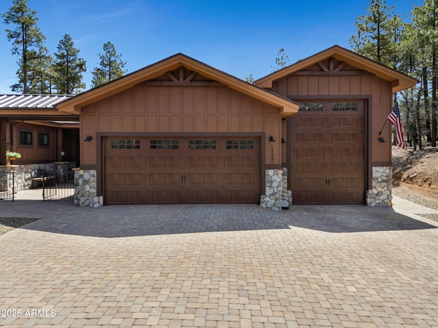1137 Timbernook Xing, Williams, AZ 86046 - view of front of house featuring a garage, stone siding, and driveway