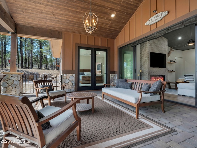 1137 Timbernook Xing, Williams, AZ 86046 - view of patio / terrace with an outdoor living space with a fireplace