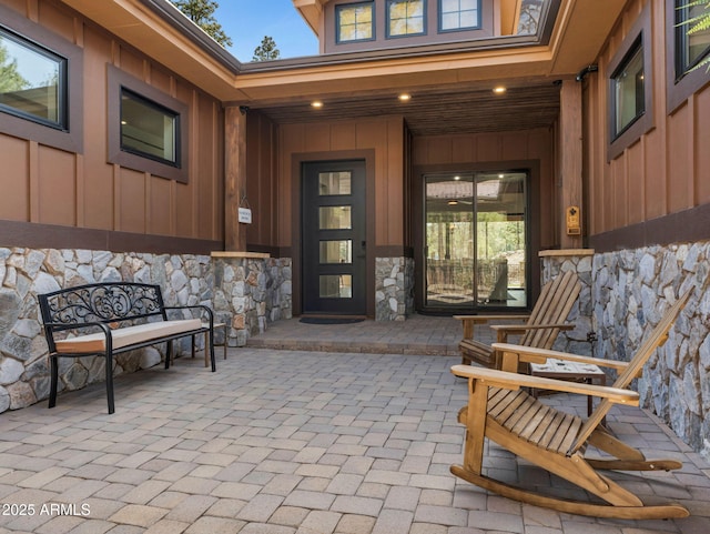 1137 Timbernook Xing, Williams, AZ 86046 - doorway to property featuring board and batten siding and stone siding