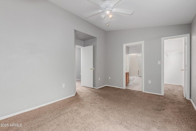 125 S 56th St Unit 124, Mesa, AZ 85206 - unfurnished bedroom featuring carpet flooring, a walk in closet, baseboards, connected bathroom, and a closet