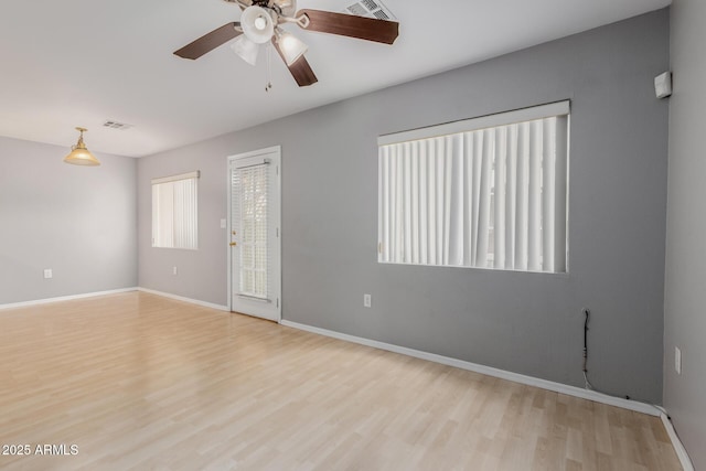125 S 56th St Unit 124, Mesa, AZ 85206 - spare room featuring wood finished floors, ceiling fan, and baseboards