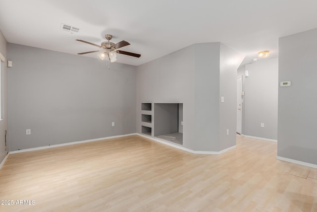 125 S 56th St Unit 124, Mesa, AZ 85206 - unfurnished living room featuring ceiling fan, light wood-style floors, baseboards, and built in shelves