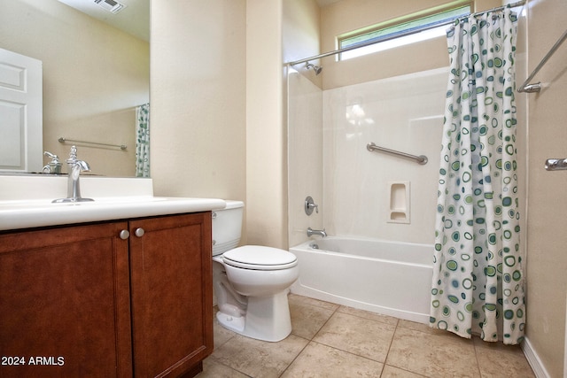 full bathroom featuring tile floors, toilet, shower / bath combo with shower curtain, and vanity