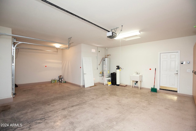 garage with sink, a garage door opener, and gas water heater