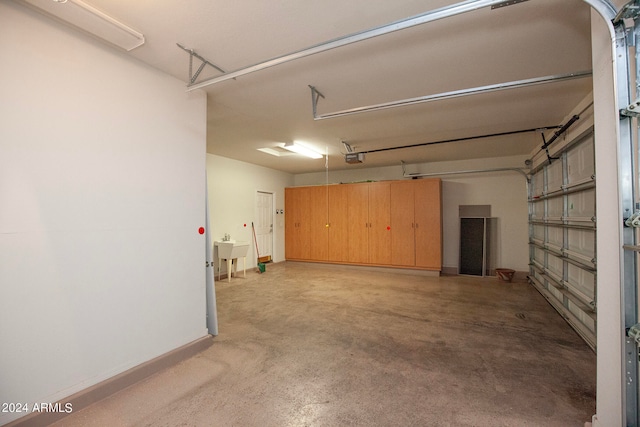 garage with sink and a garage door opener