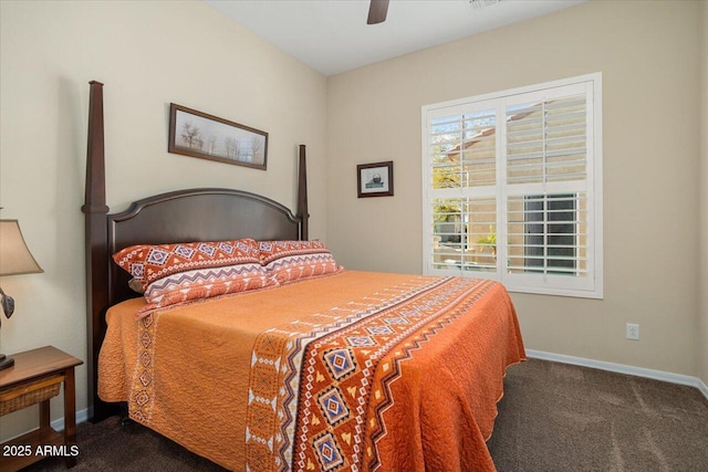 bedroom featuring dark colored carpet and ceiling fan