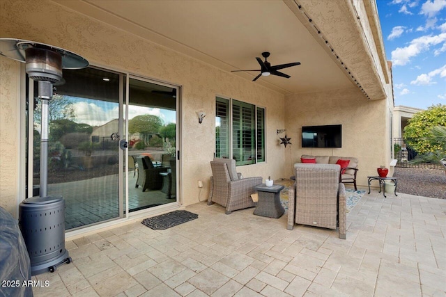 view of patio / terrace featuring ceiling fan