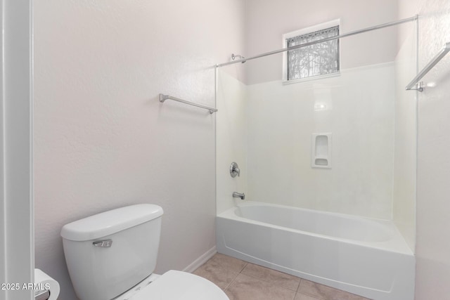 bathroom with tile patterned flooring, toilet, and shower / bath combination