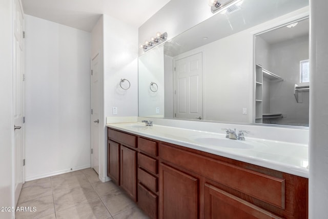 bathroom featuring tile patterned floors and vanity