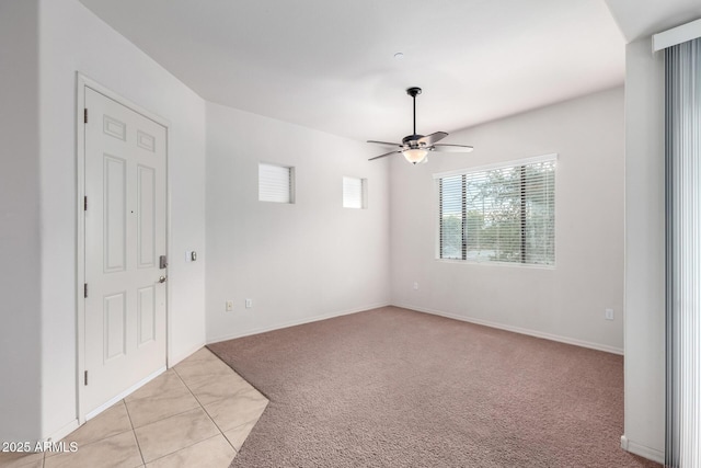 carpeted empty room with ceiling fan