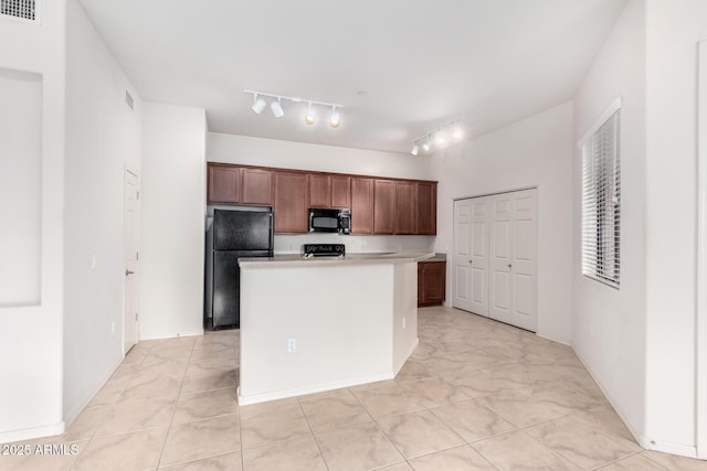 kitchen featuring a kitchen island, black appliances, and rail lighting