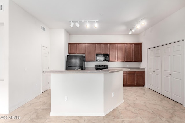 kitchen with a kitchen island and black appliances