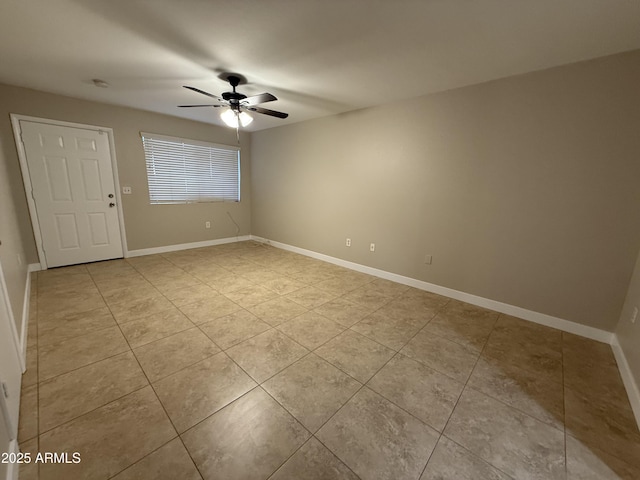 unfurnished room featuring light tile patterned floors and ceiling fan