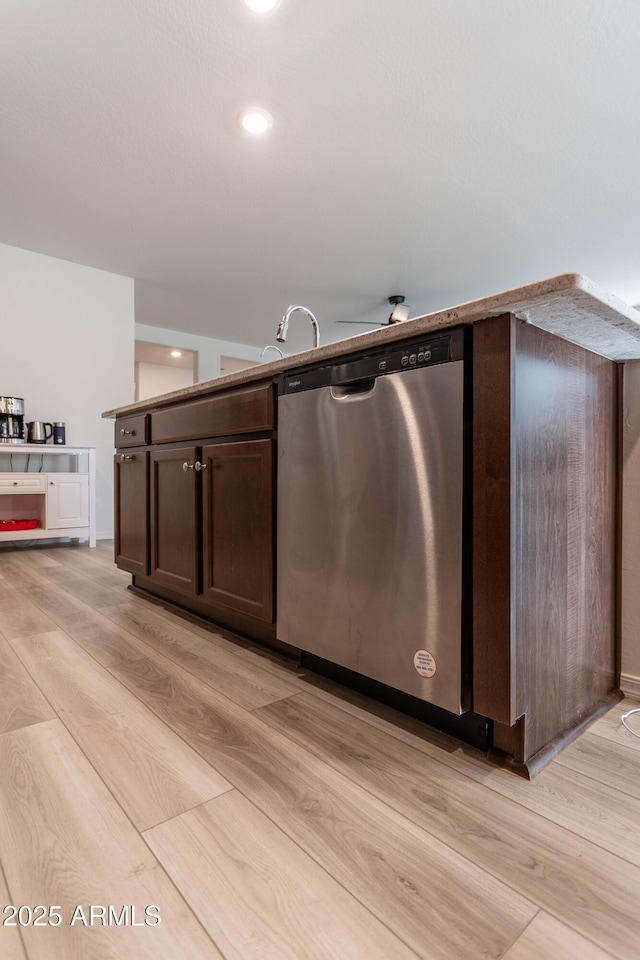 kitchen with dishwasher, dark brown cabinets, and light hardwood / wood-style flooring