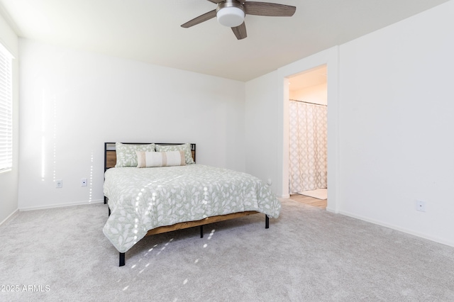 bedroom featuring light carpet and ceiling fan