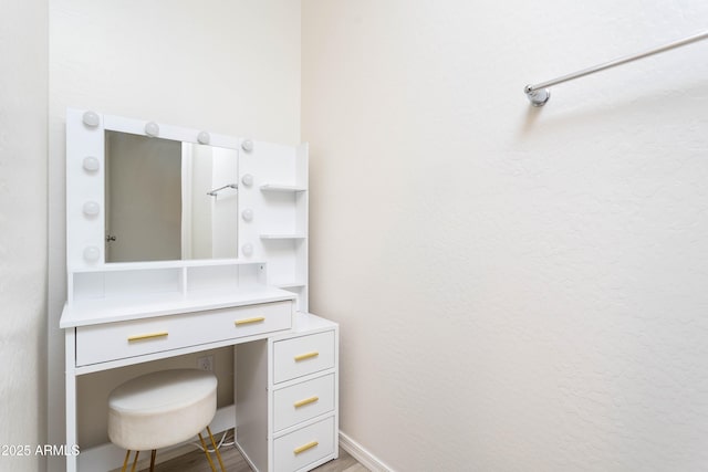 bathroom with wood-type flooring and vanity