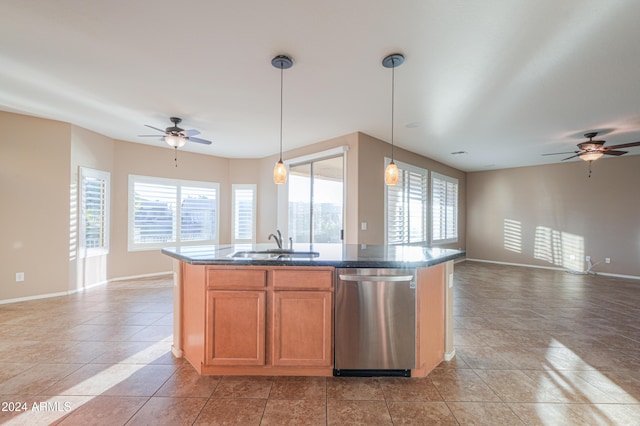 kitchen with pendant lighting, a kitchen island with sink, sink, stainless steel dishwasher, and ceiling fan