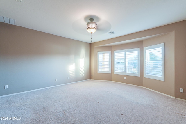 unfurnished room featuring carpet flooring and ceiling fan