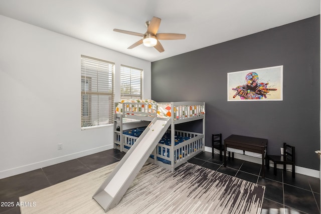 tiled bedroom with ceiling fan