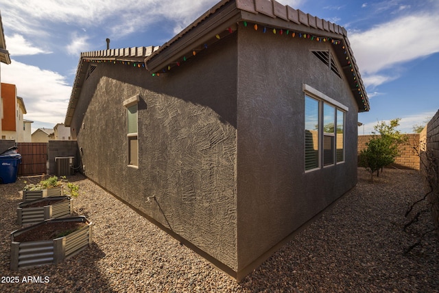 view of home's exterior featuring central AC unit