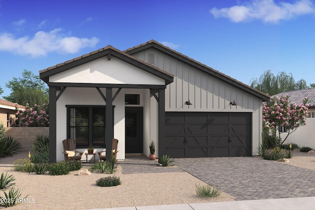 view of front of property with covered porch and a garage