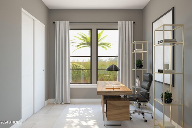 unfurnished office featuring light tile patterned floors