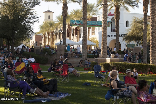 view of property's community with a lawn