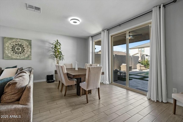 dining space featuring ceiling fan