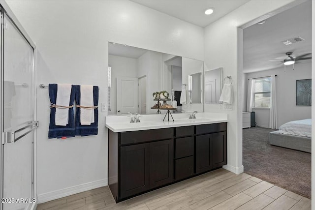 bathroom with ceiling fan and vanity