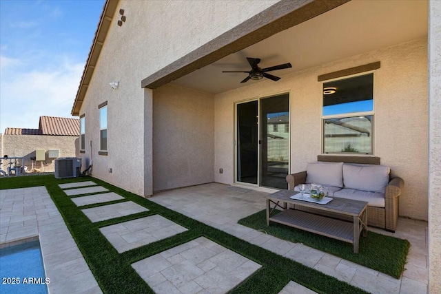 view of patio / terrace with ceiling fan, central AC, and an outdoor living space